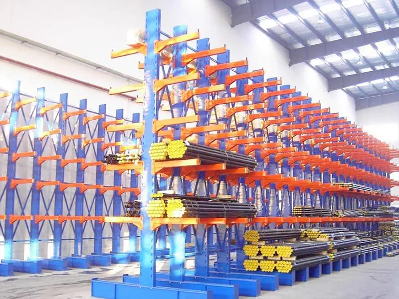 Side forklift safely loading long aluminum extrusions and structural building materials onto adjustable cantilever storage arms
