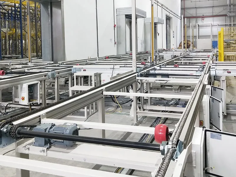 SSTC automated heavy-duty roller conveyor system transferring pallets along warehouse distribution line