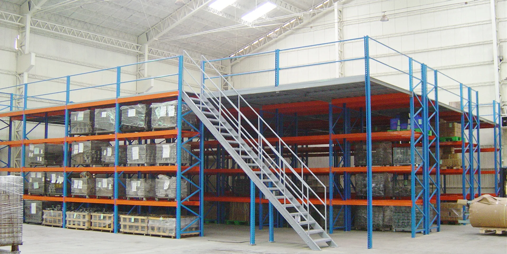 SSTC multi-tier steel platform transforming vertical warehouse space into a 2-3 storey mezzanine storage and integrated office system.