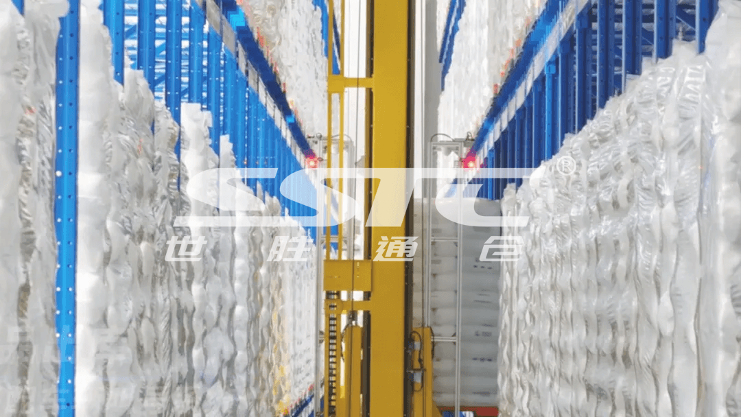 High-bay unit-load AS/RS stacker crane operating in a secure chemical industry storage facility