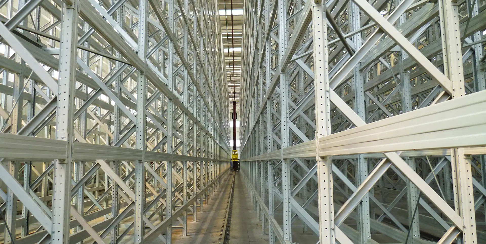 Maximize vertical space and operational throughput with high-density AS/RS automated warehousing solutions