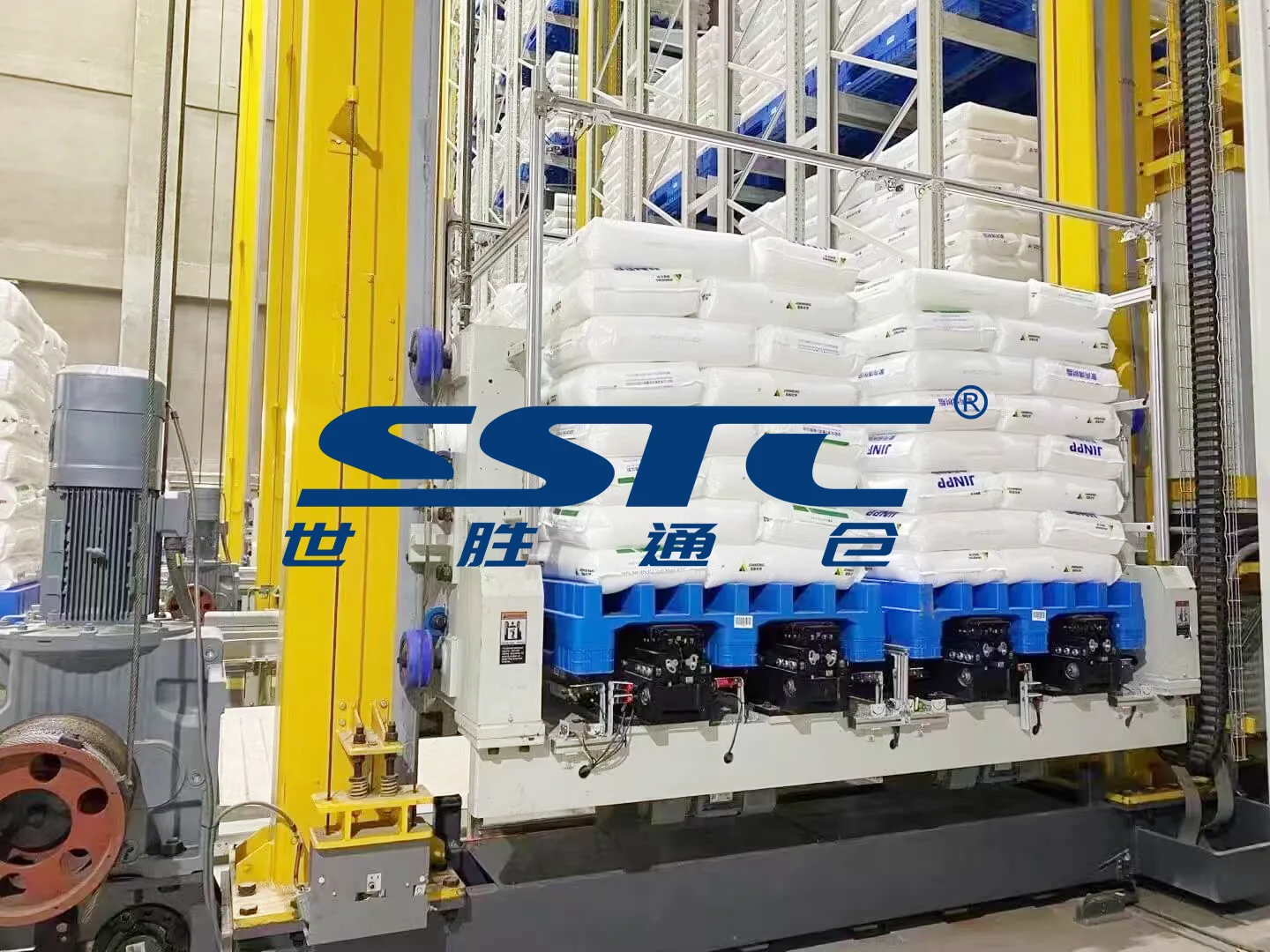 High-bay Pallet AS/RS operating dual-station double-deep stacker crane system handling two heavy chemical material pallets simultaneously inside climate-controlled automated warehouse engineered by SSTC Intelligence
