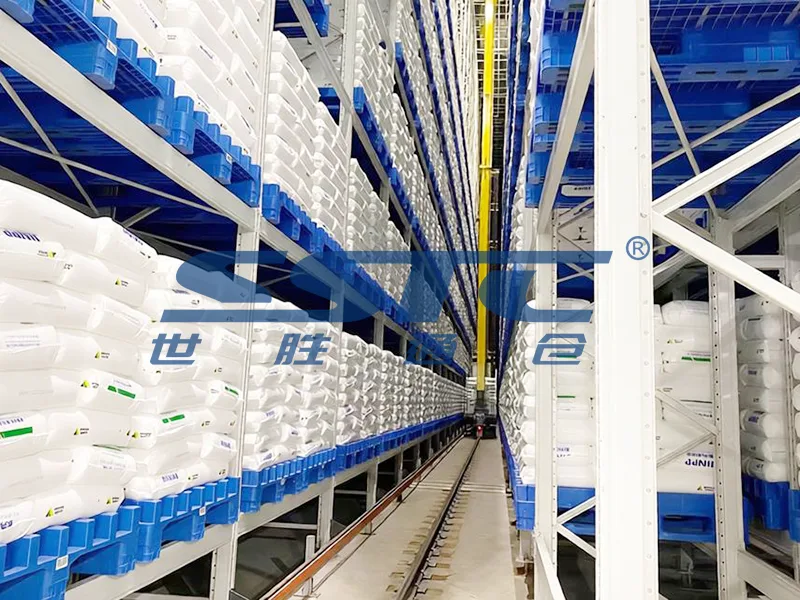 Heavy-duty high-bay steel racking frame within Pallet AS/RS storing heavy resin drums and chemical totes engineered by SSTC Intelligence
