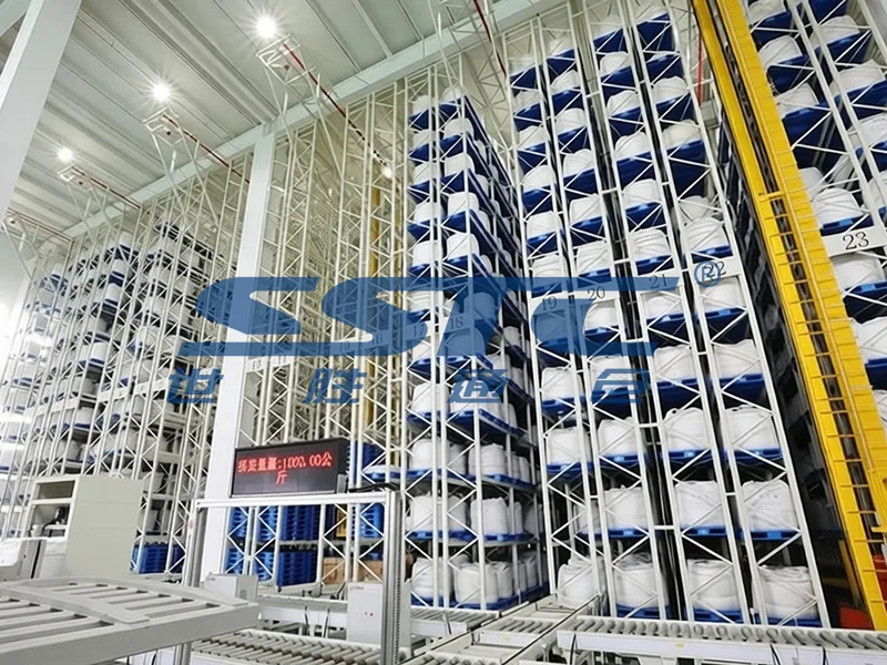 High-bay Pallet AS/RS stacker crane system handling heavy chemical raw material pallets inside hazardous material facility engineered by SSTC Intelligence