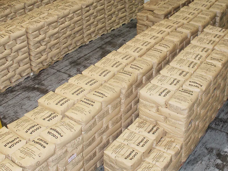 High-bay Pallet AS/RS stacker crane system storing standardized cocoa bean pallets inside climate-controlled Malaysian cocoa processing facility engineered by SSTC Intelligence
