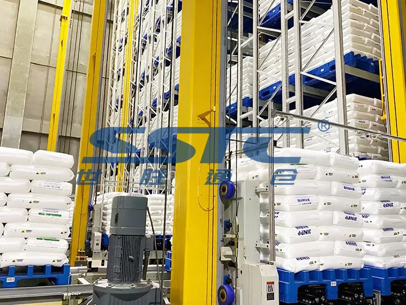 EN ISO safety perimeter fencing and optical light curtains securing automated AS/RS stacker crane operation zone engineered by SSTC Intelligence